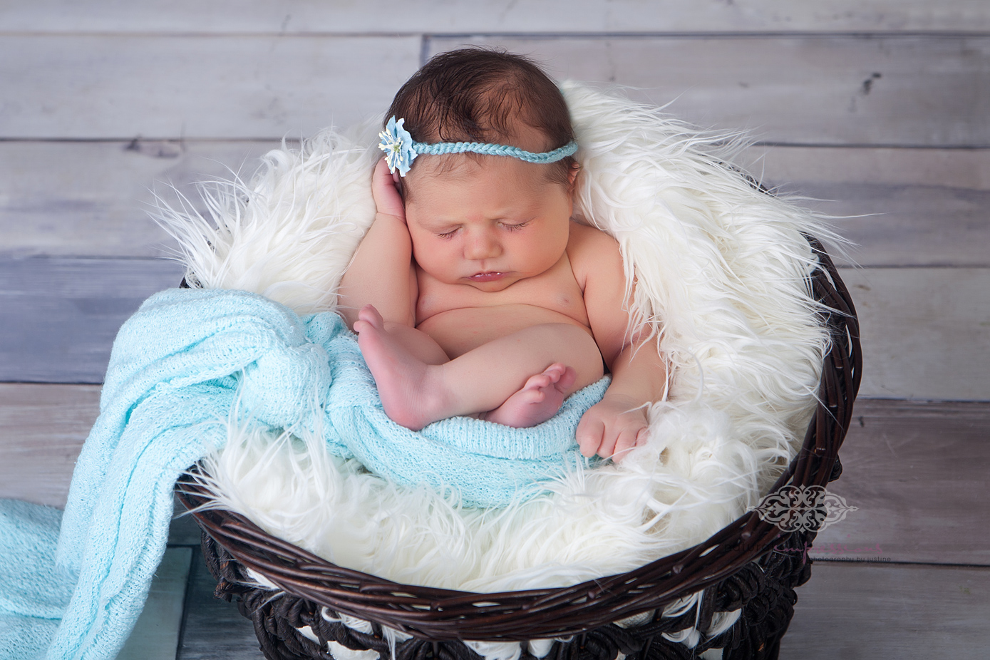 newborn in basket