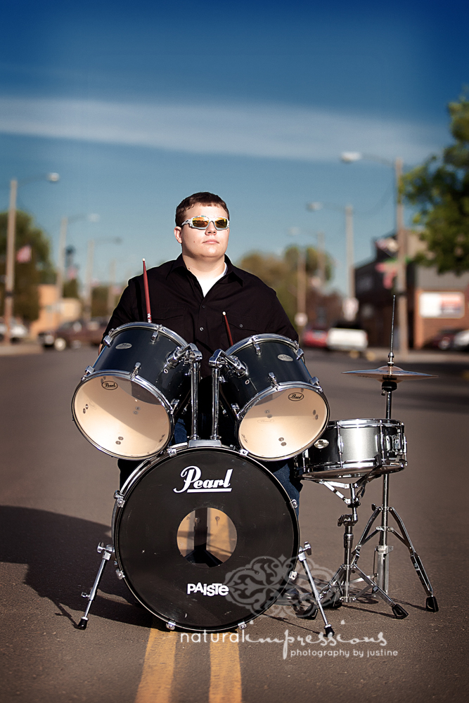 Senior plays drums on the street