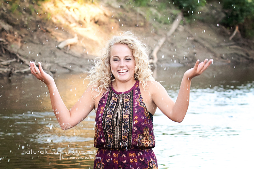 senior girl playing in water