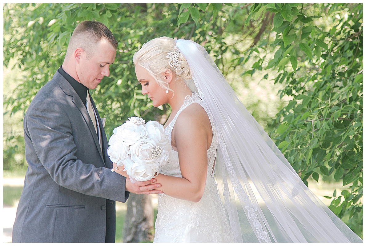 bride and groom pray together