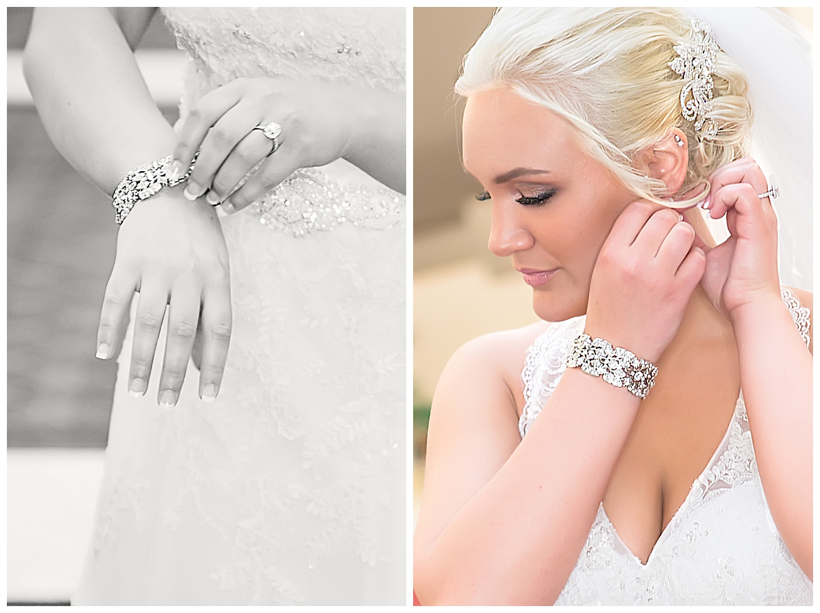 Bride putting on earrings