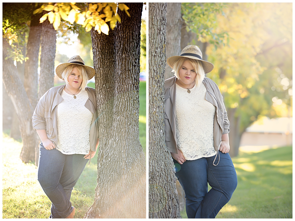 Senior girl poses by trees