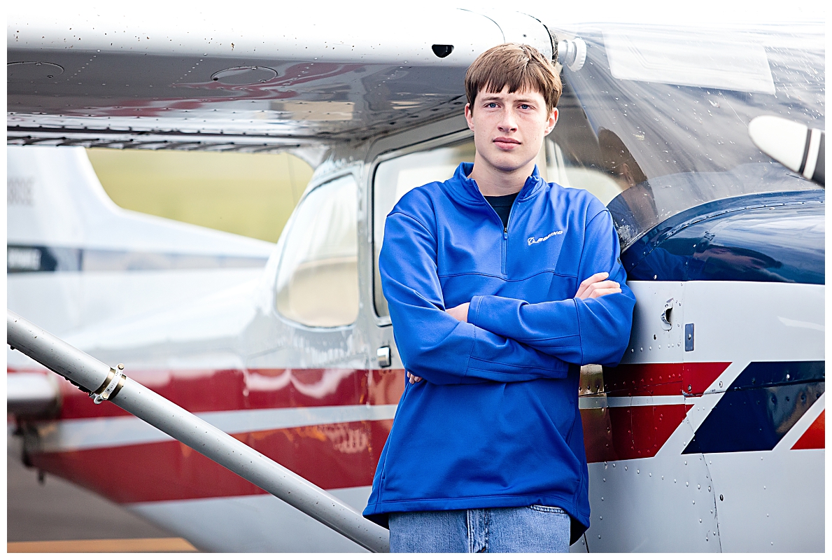 Senior boy with airplane