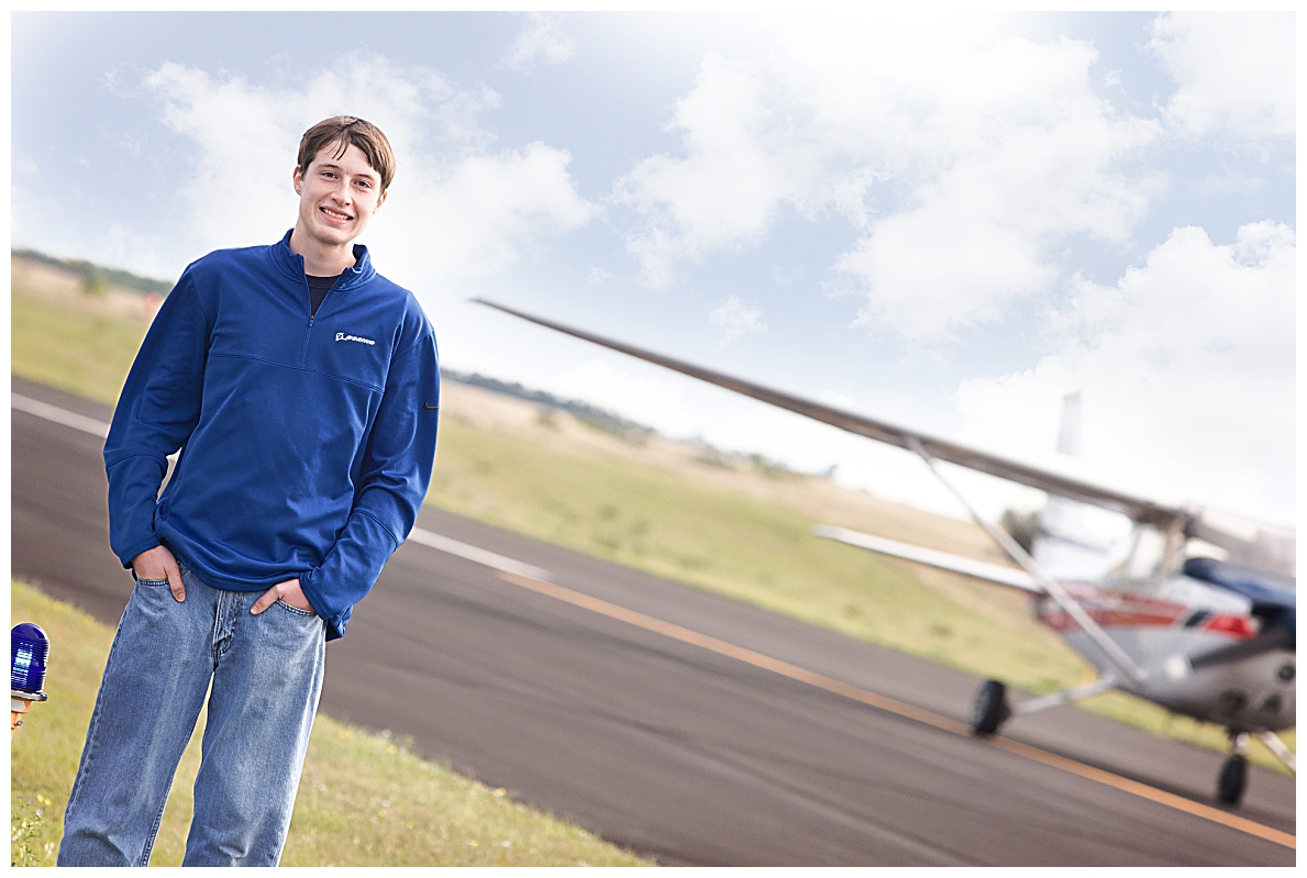 Senior boy with airplane 