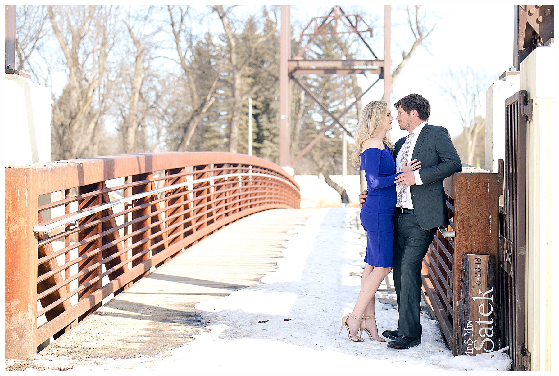 Fargo Engagement pictures on a bridge