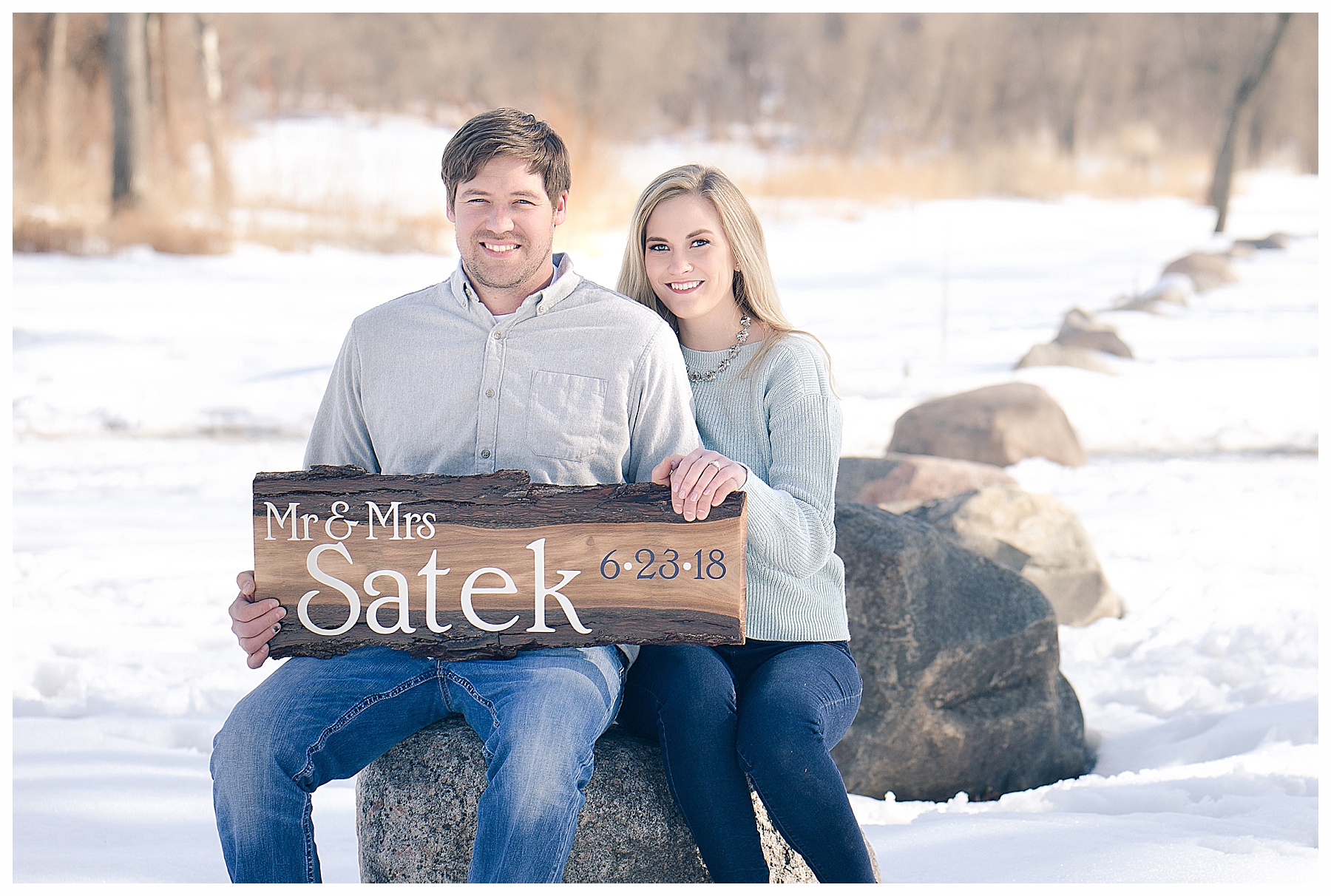 Engagement pictures with a sign