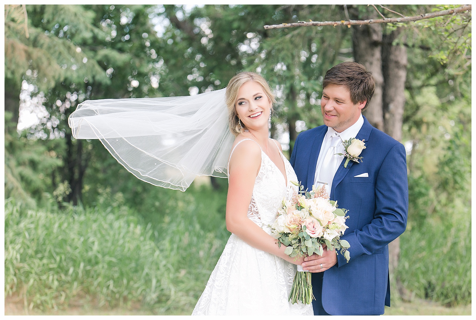 bride and groom veil in wind