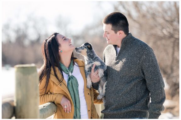 engaged couple with puppy