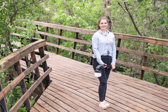 Photographer Assistant with flash on bridge