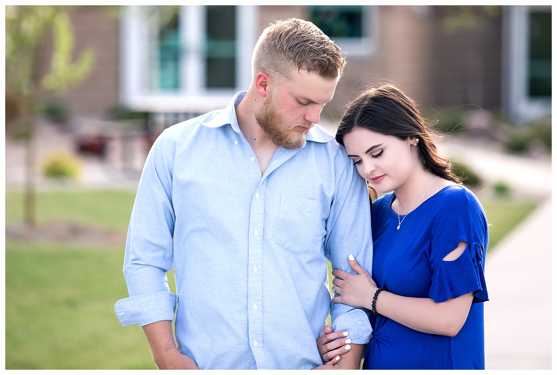 Engaged couple wearing blue
