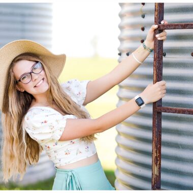 Senior girl by grain bin