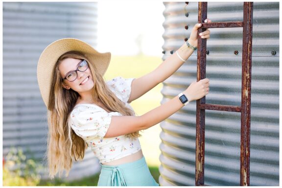 Senior girl by grain bin