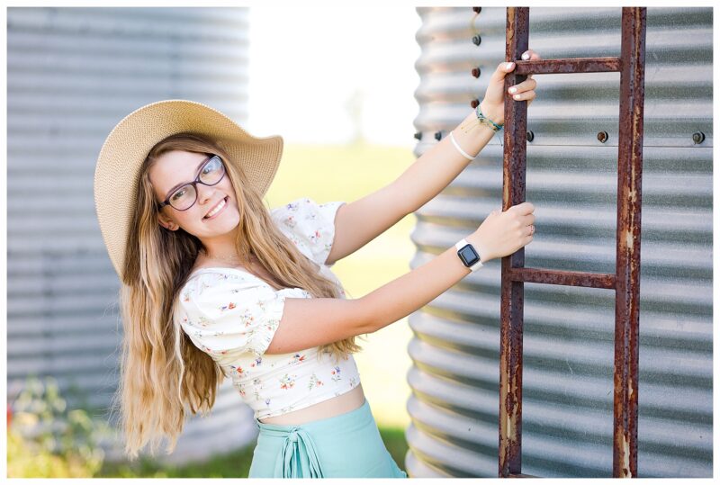 Senior girl by grain bin