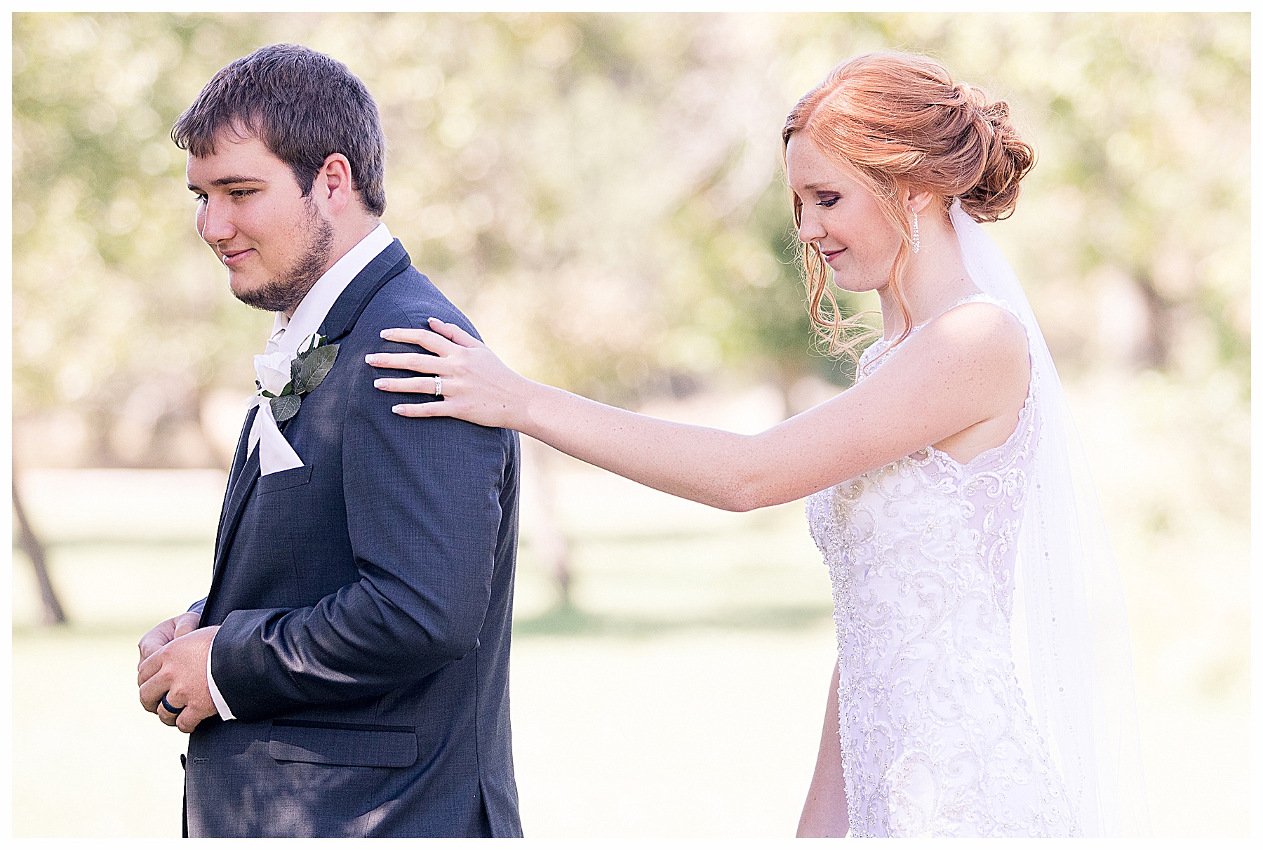 bride taps groom on shoulder for first look