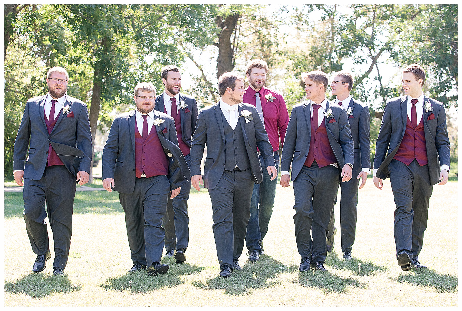 Groom and grooms mens walk in sunny field