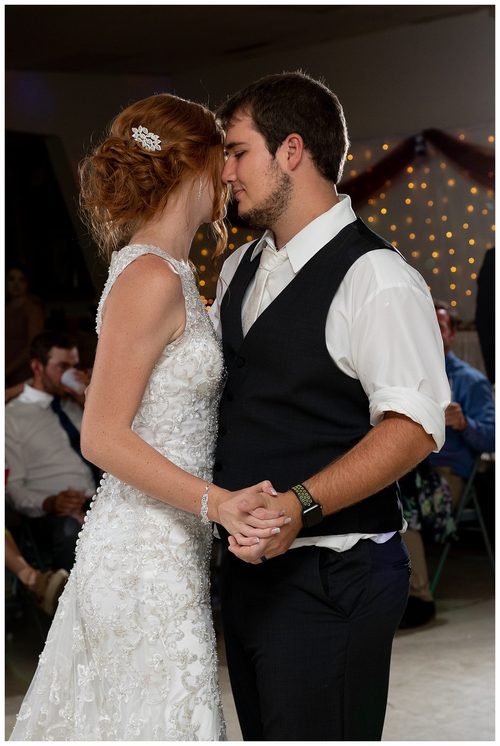 redhead bride dances with groom during first dance