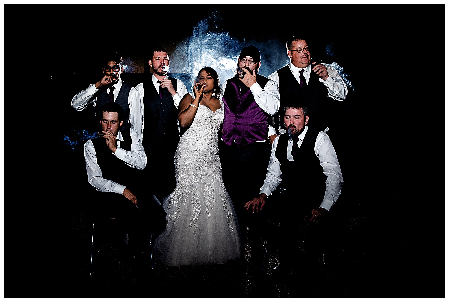 bridal party smoking cigars at night