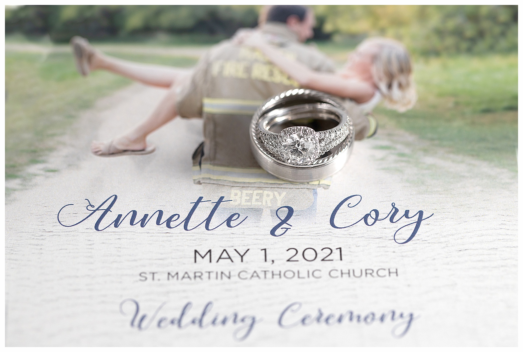 close up of wedding rings on photo wedding invitation