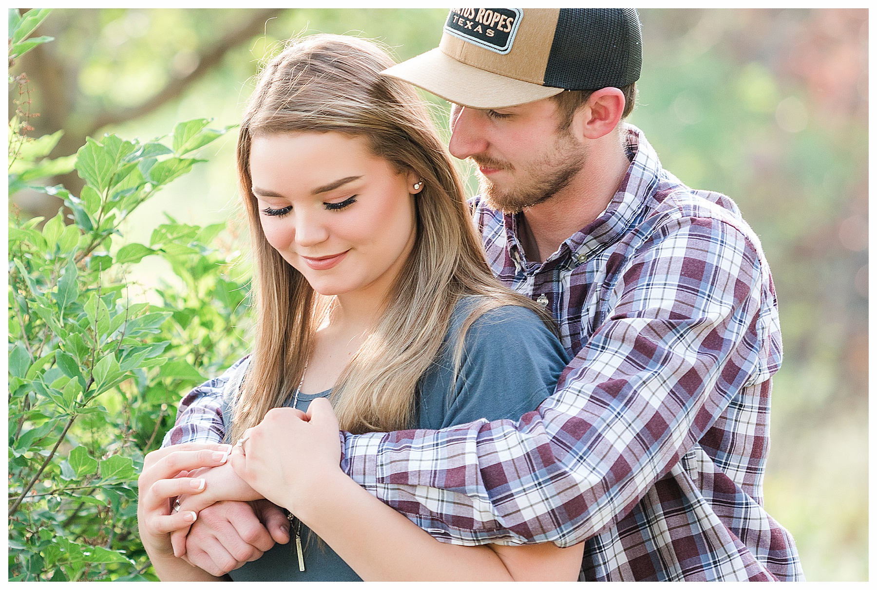 guys hugs finance around the shoulders during summer engagement session