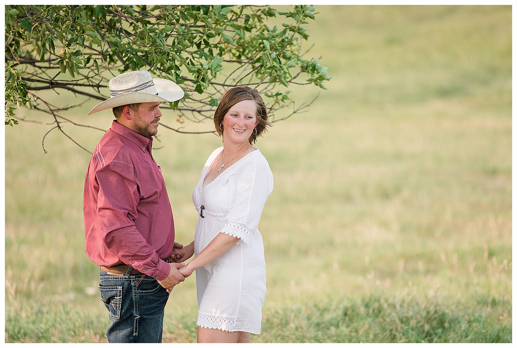 future bride wears white sundress during engagement pictures