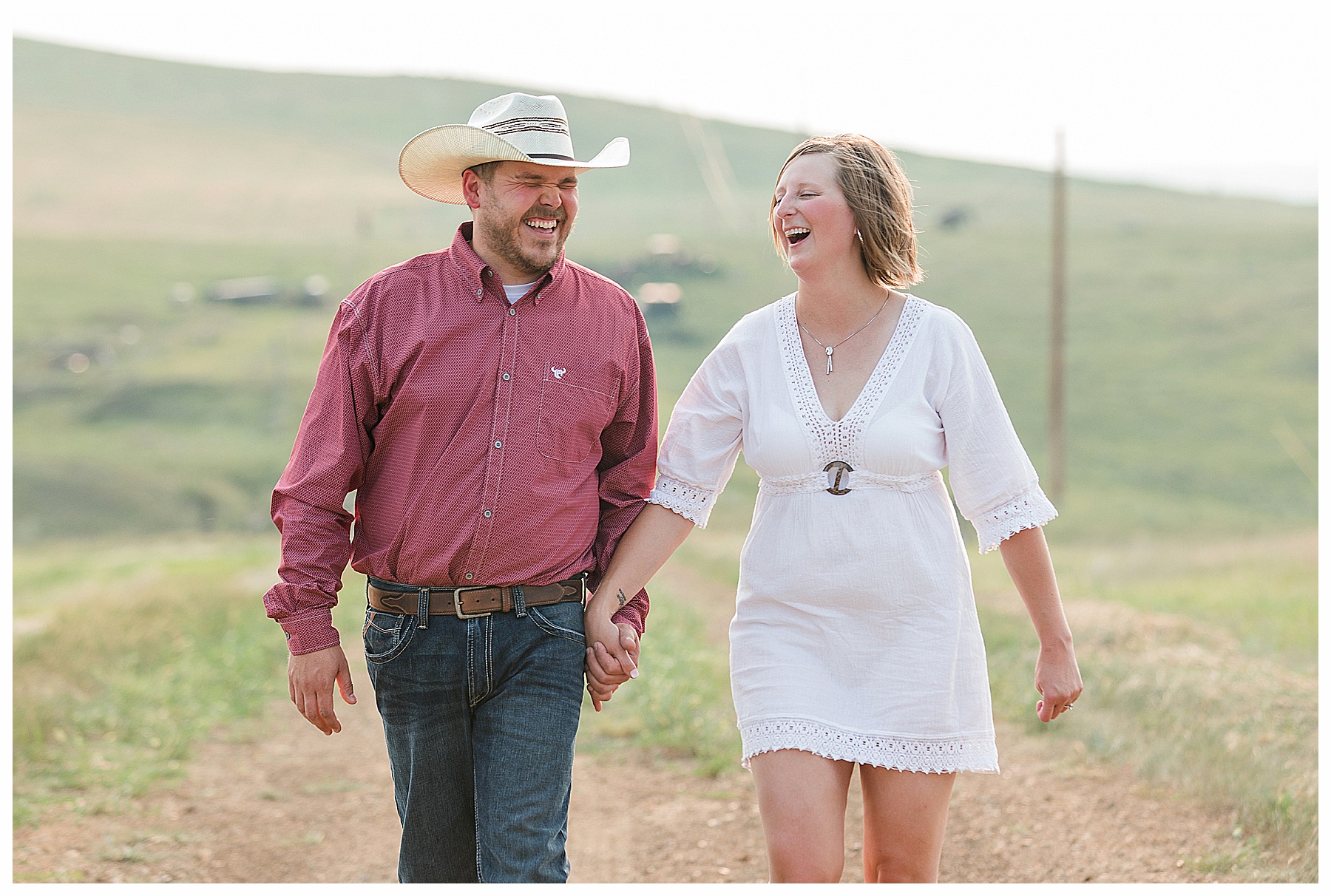 Engaged couple laugh and walk together