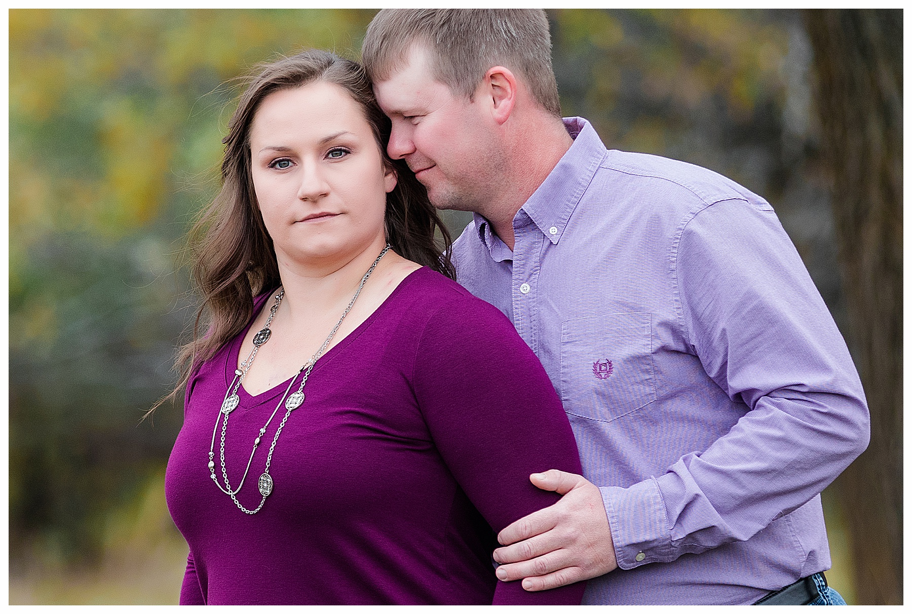 Engaged couple wearing purple 