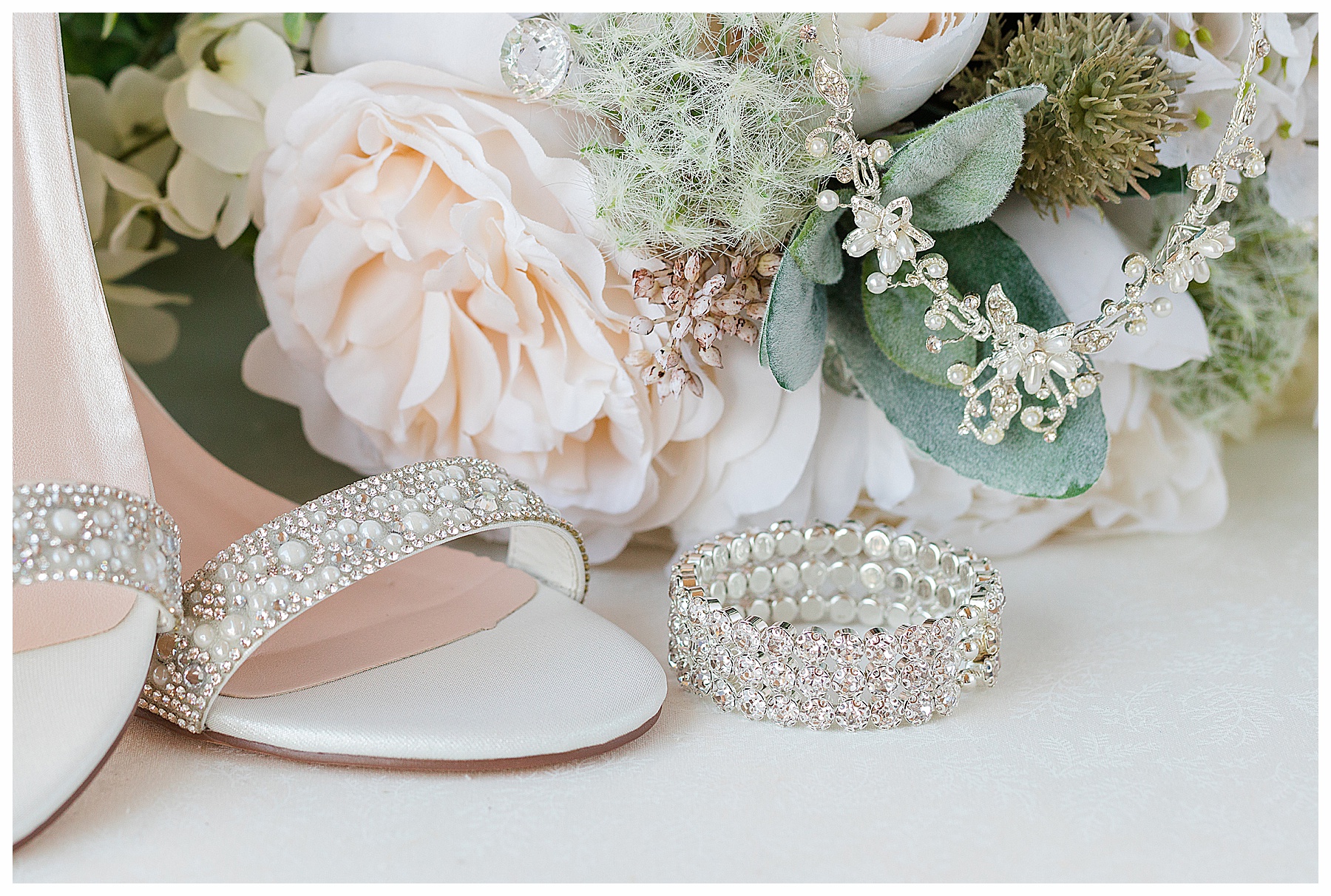 detail photo of bride's shoes and jewelry, bracelet and necklace
