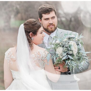 Bride and Groom look into the distance white hazy look