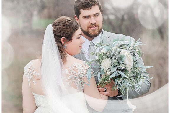 Bride and Groom look into the distance white hazy look