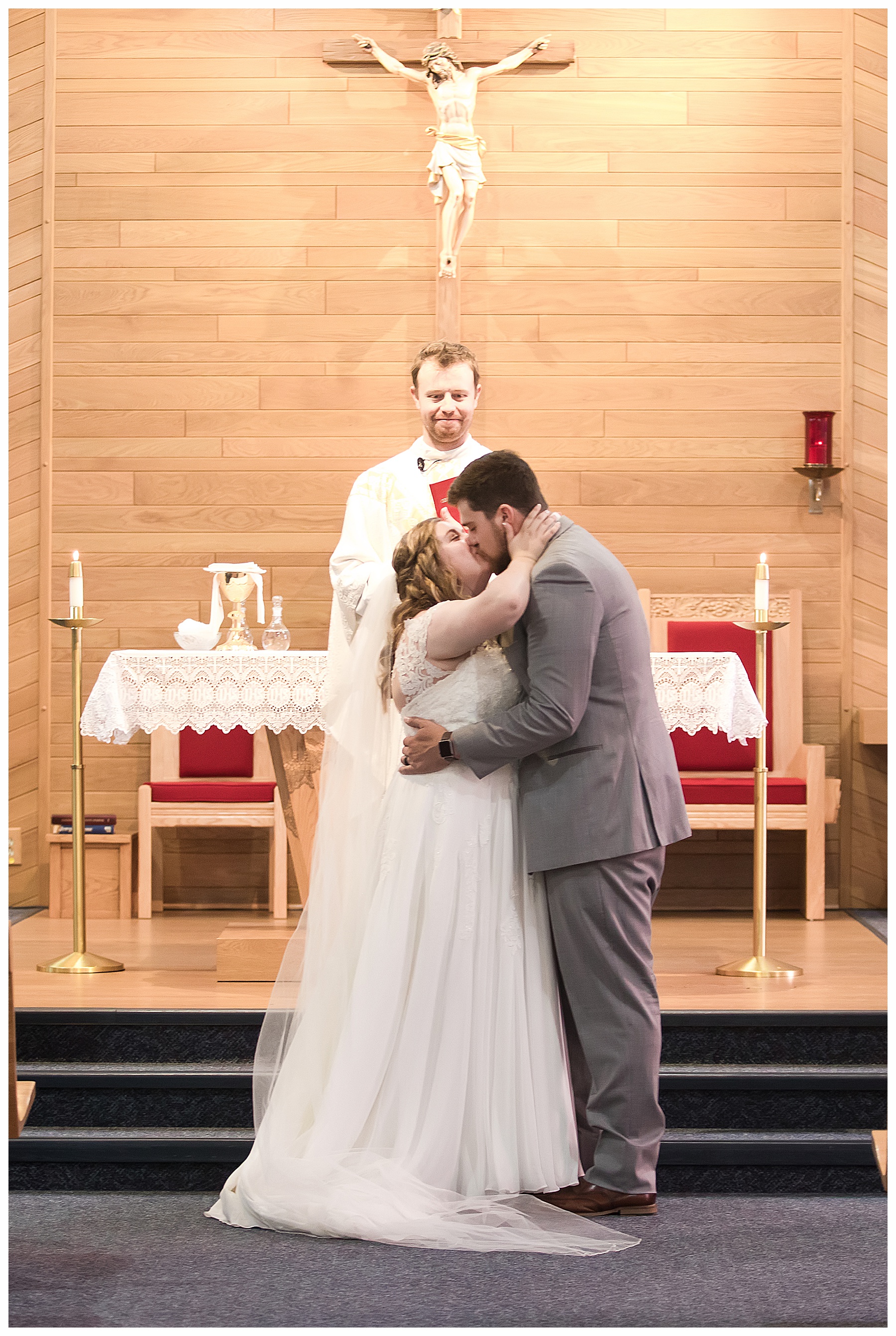 first kiss as husband and wife during wedding ceremony
